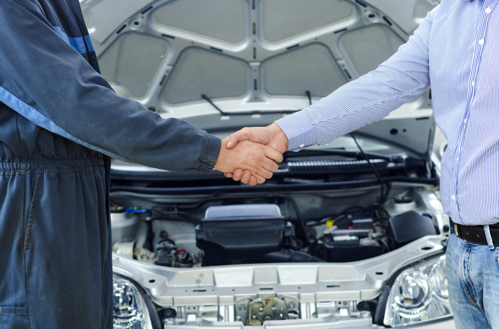 car-mechanic-customer-shaking-hands